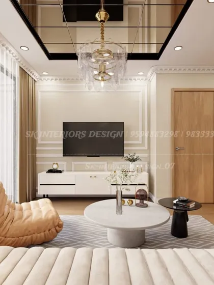 A view from the sofa, looking towards the TV and entrance. This showcases the practical layout and the balance between comfortable seating and functional furniture.