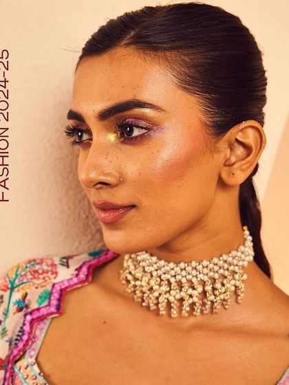 A close-up of our pearl ghungroo choker, a perfect piece to add drama to your festive fashion look.