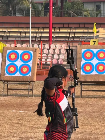 A close-up of one of our junior archers at full draw with her compound bow, showing great form and concentration.