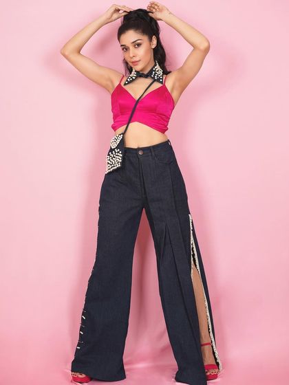 A full-length view of Eisha's outfit, showcasing the wide-leg pants with slit details. This demonstrates my work on curated and designed concept shoots.