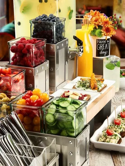 A beautiful Sunday brunch, ready for our clients. This setup features a fresh salad and appetizer bar with a variety of toppings and ingredients, perfect for a relaxed get-together.