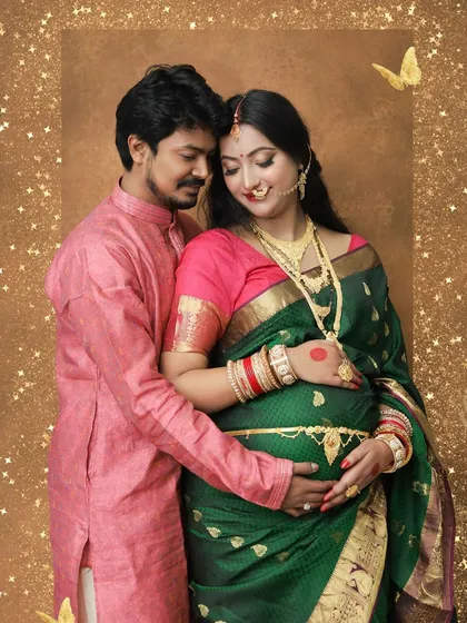 We celebrate love in all its forms, including beautiful traditional attire. This couple's portrait in a stunning green saree and kurta shows how we blend cultural elegance with intimate maternity photography for a truly personal session.