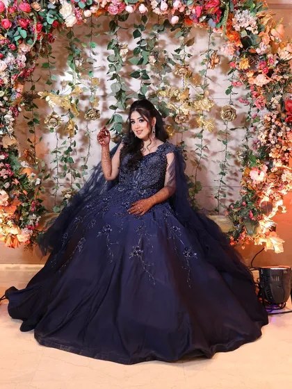 This full-length shot shows how the gown's cape and skirt create a stunning, dramatic look. My plus-size rentals are perfect for making a grand entrance.