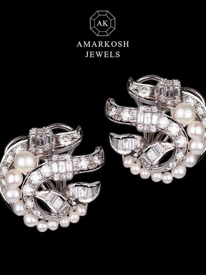 A full view of the intricate diamond and pearl earrings, perfect for those who appreciate the finer things in life.