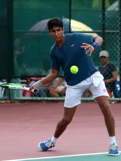 Tavish Pahwa stretching for a difficult shot, showcasing the agility and court coverage we develop in our athletes during a match at the World U14 Asia Oceania competition.