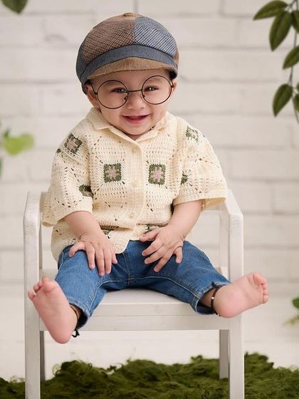 A relaxed and happy portrait. This little one's comfortable smile shows how we prioritize a fun and stress-free environment during our sessions.