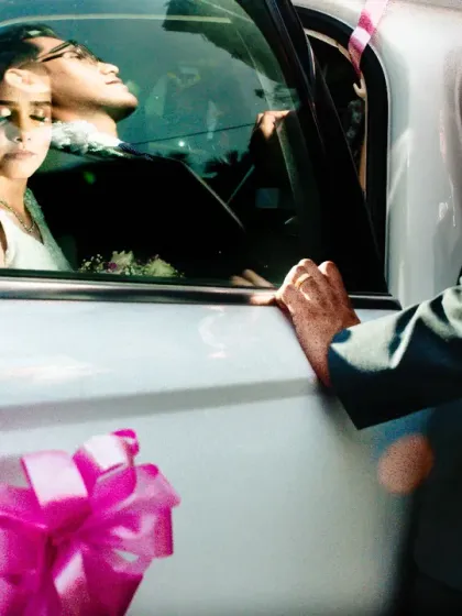 A creative shot using the car window to reflect the couple's faces. I love playing with reflections to add depth and layers to my images.