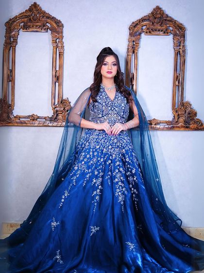 A classic portrait pose in our stunning blue ball gown.