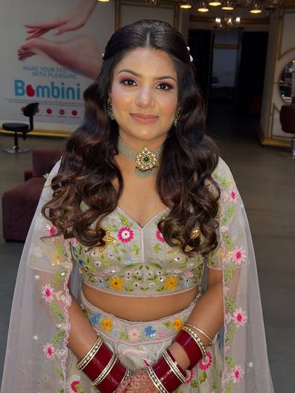 A closer view of the happy client, showing her glowing skin and the details of her hairstyle.