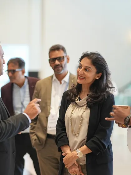 I believe in building partnerships. This image shows me listening to a group of educators at the TAISI conference, learning about their unique challenges and sharing insights on how to foster better parent-teacher communication.
