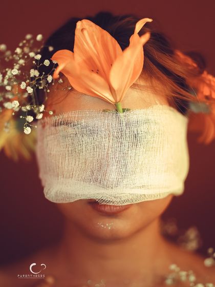 A direct, symmetrical composition that is both beautiful and unsettling. It challenges the viewer to think about sight and perception.