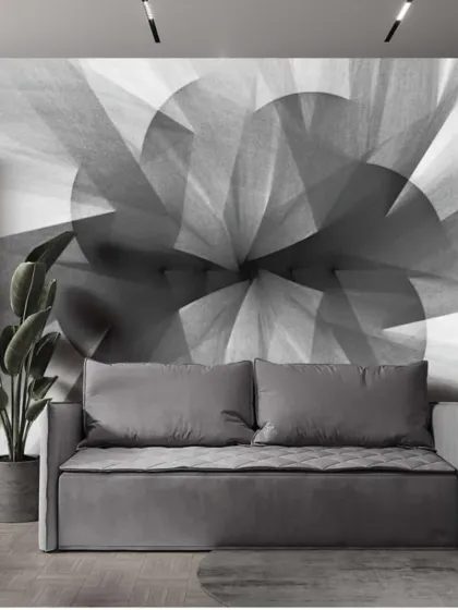 A large-scale abstract geometric mural in shades of grey. This dynamic design creates a strong focal point in a modern living space.