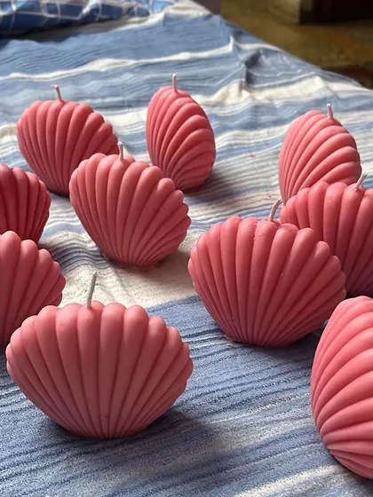These shell-shaped candles were made for a baby shower. The pink color is perfect for welcoming a baby girl.
