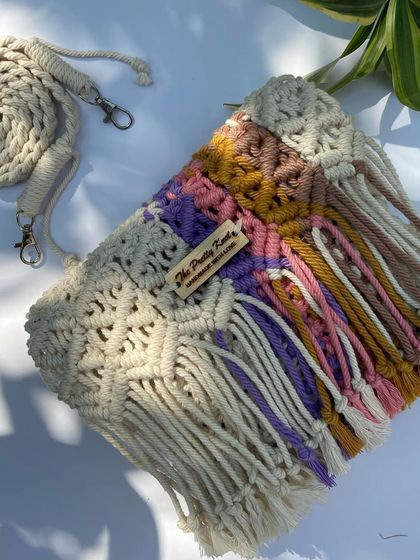 This multicolored box bag gives off such a happy, boho vibe. The pastel colors are perfect for anyone who loves a softer palette. It measures 8.5 by 7 inches.
