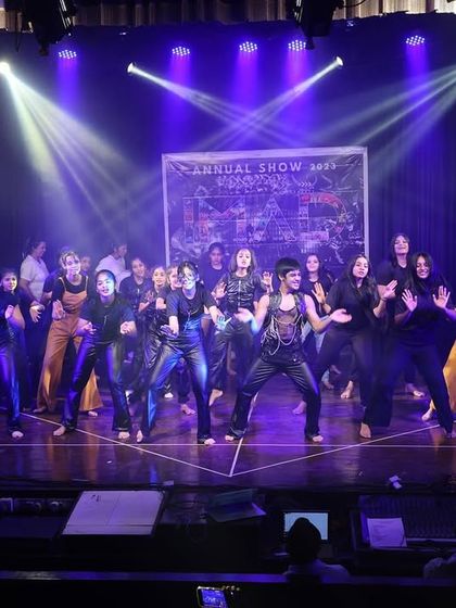 The stage is alive with movement and energy during this group performance at the Tarulya 2023 showcase.