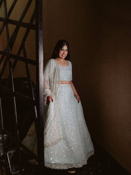 A full-length shot of her beautiful, shimmering lehenga.