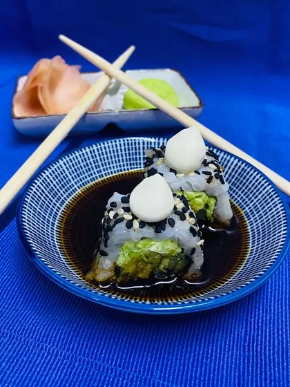 Our Truffle Edamame Sushi is a gourmet delight, combining earthy truffle with fresh edamame and perfectly seasoned rice, topped with a dollop of mayo.