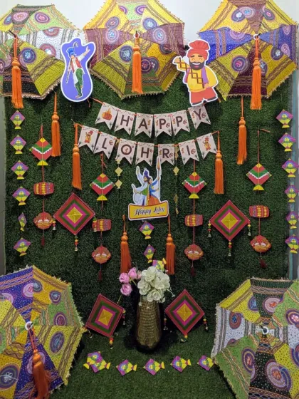 A slightly different arrangement of the green wall Lohri backdrop, showing how the decorative elements can be adjusted to fit different spaces.