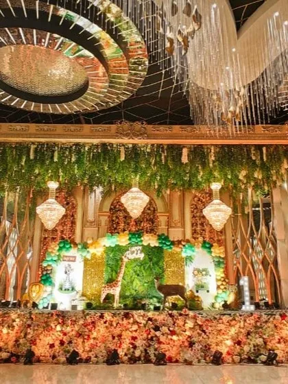 The beautifully decorated stage and dining area of a luxury wedding venue, ready for the celebration.