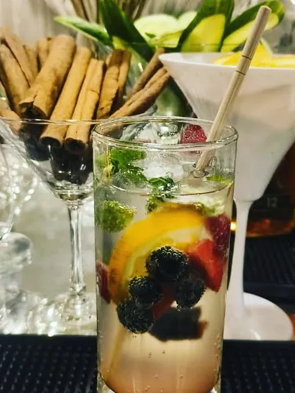 A refreshing and colorful mixed-berry mojito, packed with fresh fruit and mint. It's the perfect drink for a summer celebration.