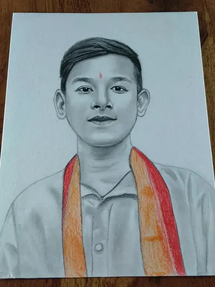 A portrait of a young boy with a colored scarf. A little bit of color can add a lot of personality to a sketch.