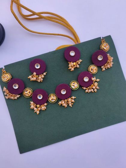This elegant Kundan necklace set is made with deep purple fabric discs and pearl clusters. I can customize the fabric color to perfectly match your wedding or festive attire.