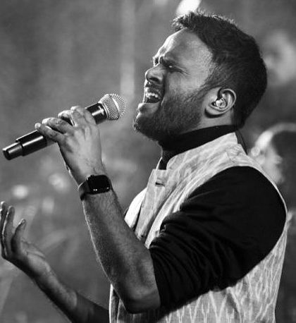 A powerful black and white photograph of our Hindustani vocalist performing with deep emotion. Music is the soul of our productions, and this image captures that passion.