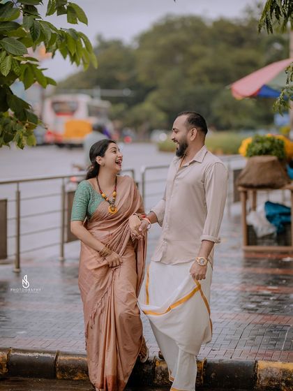 A moment of shared laughter while walking down the sidewalk. Genuine happiness makes for the best photographs.