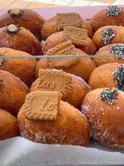 A display of my assorted stuffed donuts at a pop-up event. The Biscoff and Nutella ones are always the first to go.
