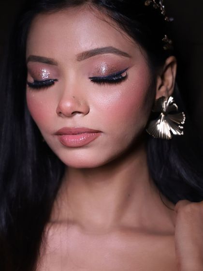 A final shot of the glamorous look, with a focus on the beautiful, sparkling eye makeup.