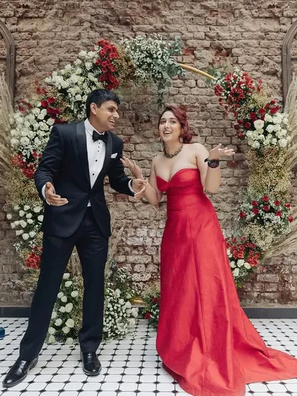 The couple breaks into a dance after their engagement, full of life and joy. This captures the celebratory spirit of the moment perfectly.