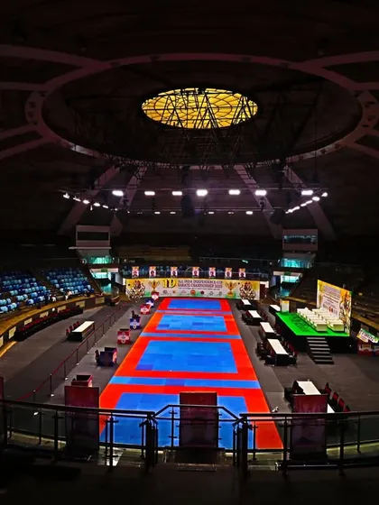 The calm before the storm. The world-class Talkatora Indoor Stadium in New Delhi, fully prepared for the 19th All India Independence Cup Karate Championship, where India's best compete.
