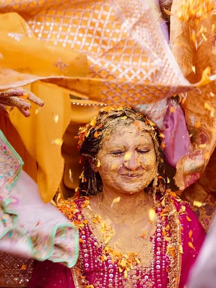 A traditional moment during the haldi where the bride is covered by a decorative cloth. I look for these culturally significant details to tell a complete wedding story.