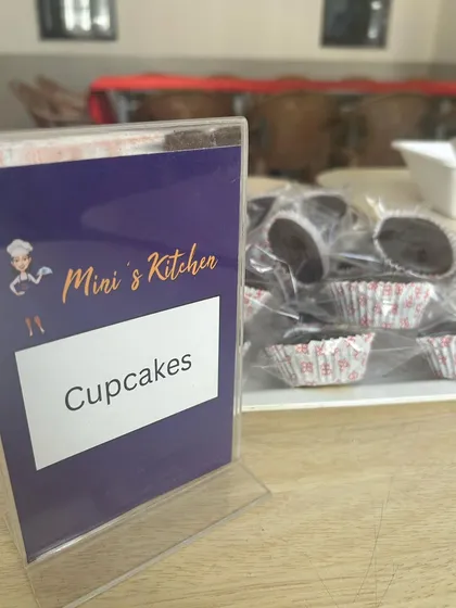 Individually wrapped chocolate cupcakes ready for a school event. These small touches make any lunch feel like a celebration and are a great way to boost team morale.
