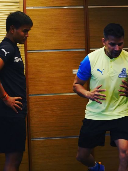 A one-on-one conversation with a player, explaining the nuances of a movement.