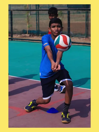 Eyes on the ball, this young athlete demonstrates the concentration required for a perfect bump. We teach our players to be ready and balanced.