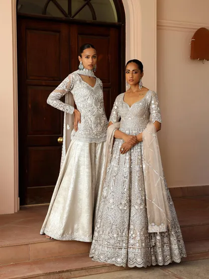 For this Saisha campaign, I focused on creating a look of timeless elegance. The styling highlights the intricate silver embroidery on the ivory lehenga and sharara set, presented in a clean, grand setting to emphasize the luxury and craftsmanship of the collection.