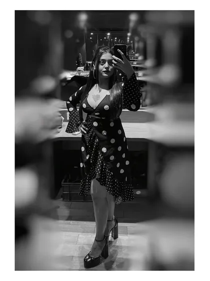 A black and white selfie showing off my retro-soul look for a gig. The polka dots and heels felt perfect for a night of jazz and R&B.