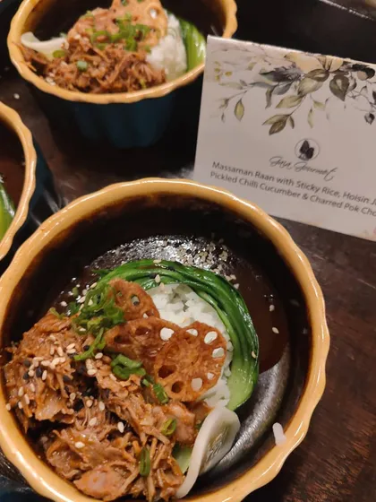 Our Massaman Raan with Sticky Rice, a hearty and flavourful bowl served at the "Made In Heaven" party. It's a perfect example of how we do luxurious small plates for a flying buffet.
