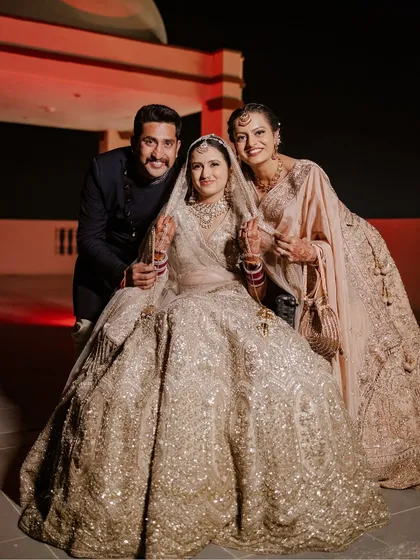 A wedding is about family. This beautiful portrait of the bride, Stuti, with her loved ones showcases the importance of capturing those cherished family moments on the big day.