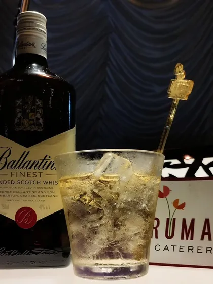Sometimes, simple is best. Alongside our creative cocktails, we expertly serve classic drinks like this Ballantine's Scotch Whisky on the rocks, catering to all of your guests' preferences.