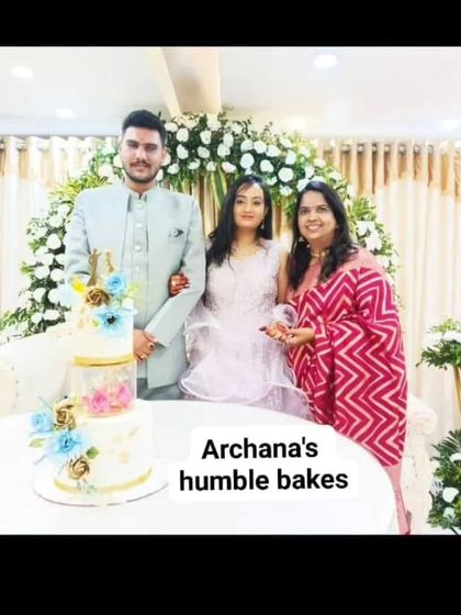 Me with the gorgeous couple and their engagement cake. It's an honor to be part of their special day.