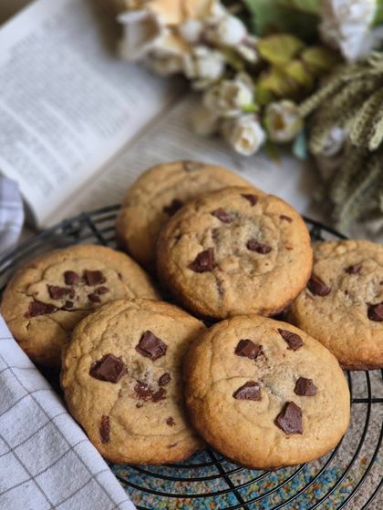 A fresh batch of my chocolate chip cookies cooling on a wire rack. They are perfectly soft, chewy, and loaded with dark chocolate chunks.