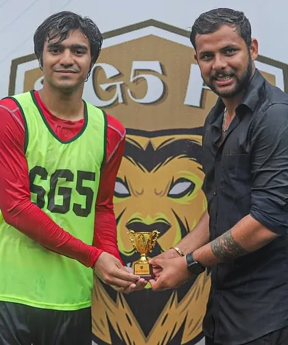 A senior player receives his Player of the Match award, proving that recognition matters at every level of the game.