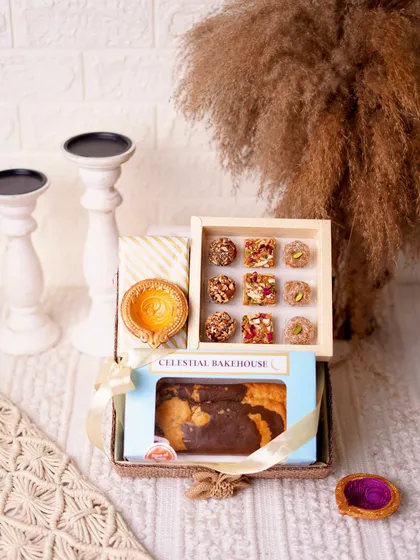 The 'Pure Indulgence Hamper' for Diwali combines a buttery tea cake and a box of handmade mithai with a ceramic aroma diffuser, creating a gift for all the senses.