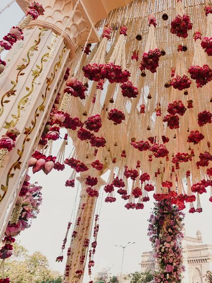 Another angle of the lotus and rose canopy, showcasing the intricate craftsmanship and the sheer volume of flowers used to create this luxurious effect.