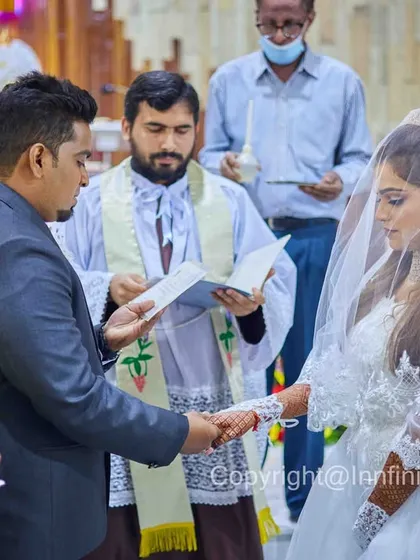 I am experienced in capturing the unique traditions of all weddings. Here, during a quiet moment in a Christian ceremony, I focused on the solemn exchange of vows, preserving the reverence of the moment.