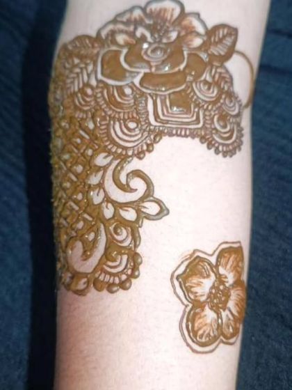 The start of a heavy bridal design. This shows how I build up the pattern, starting with a few key floral motifs on the arm.