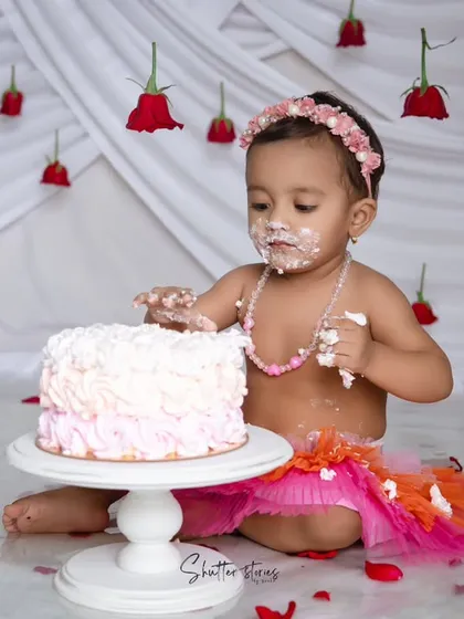 Getting into the fun, with frosting on her face and hands.