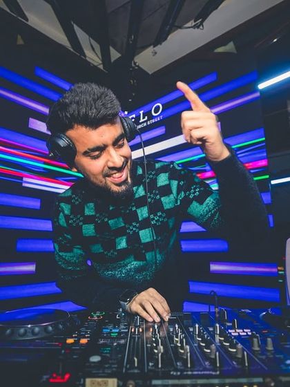 Pointing to the crowd, getting ready for the next drop. My sets are a conversation with the dance floor, and this is me asking if they're ready for more.